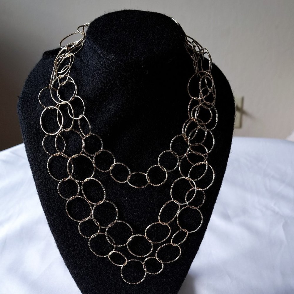 Gold toned ring necklace.